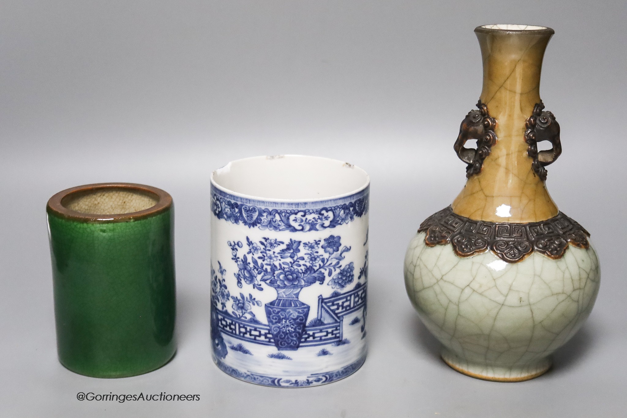 A Chinese crackleglaze vase, a blue and white brush pot and a green glazed brush pot, tallest 22cm